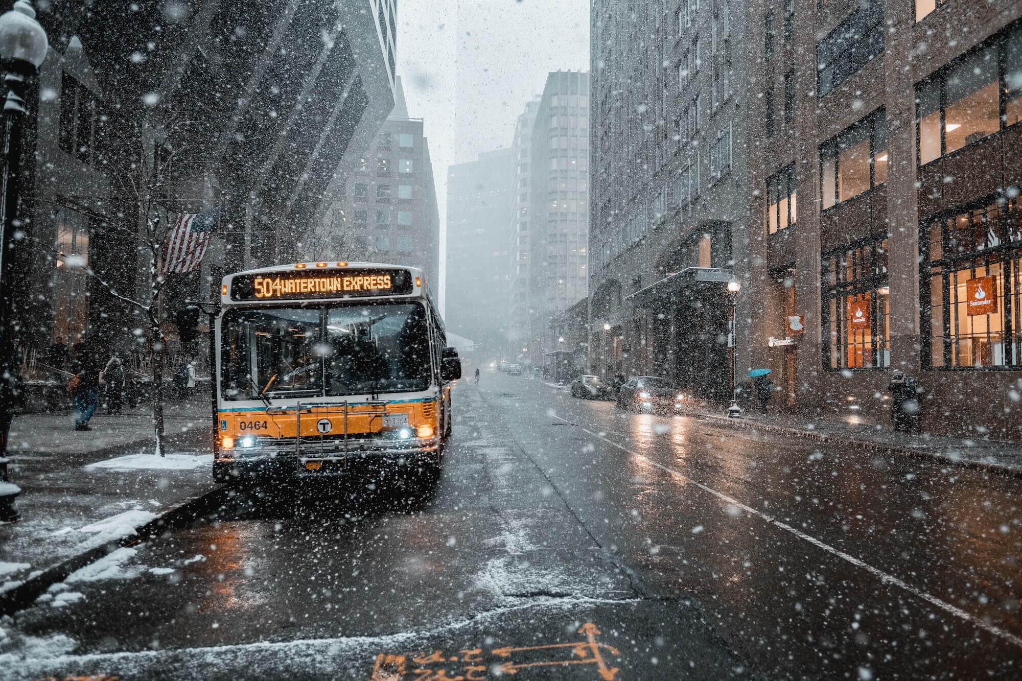 a bus in a snowing city